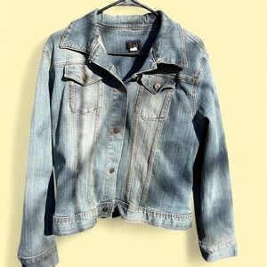 Light blue denim jacket with a relaxed fit and copper buttons